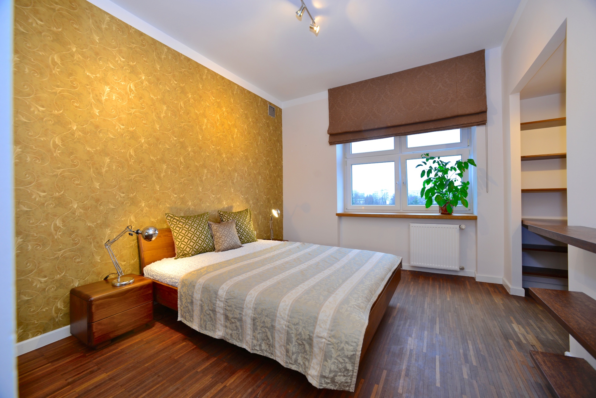 A large bedroom with lavish finishings